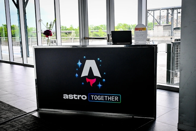 Black registration bar with the Astro Together logo across it in white, blue, and red.