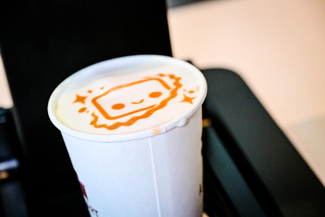 Close up of a coffee printed with Houston on it.