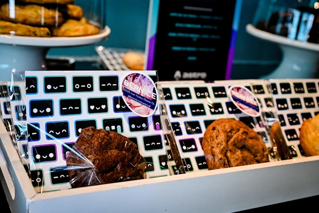 Closeup of cookies at the gourmet cookie bar. The cookie bags are clear with Houston patterned inserts. The bags are branded with Bernice, a bakery.