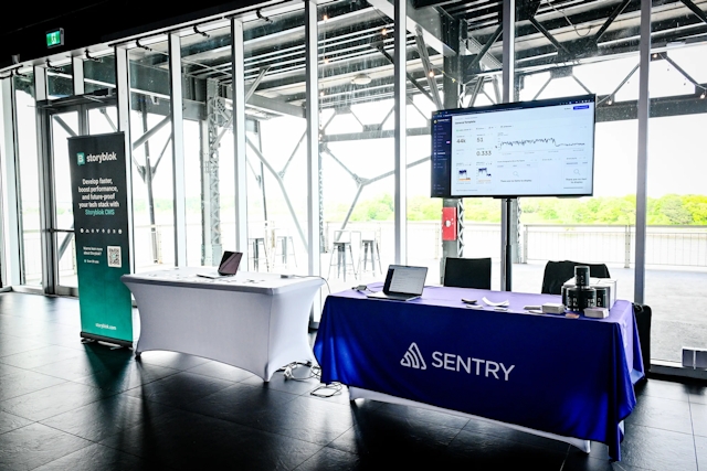 Sponsor booths for Storyblok and Sentry.