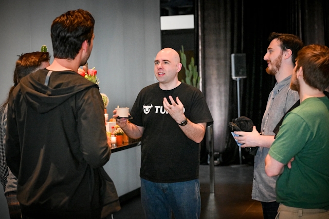 Glauber, of Turso, speaking in a group with core contributors and maintainers from Astro.