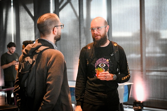 Two male guests networking.