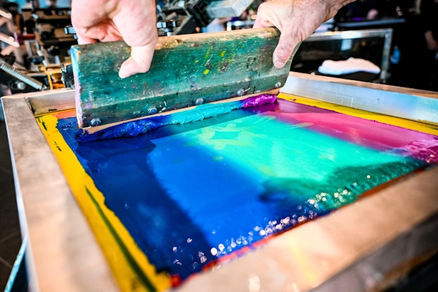 Closeup of the paint-like material used in a t-shirt printing press.