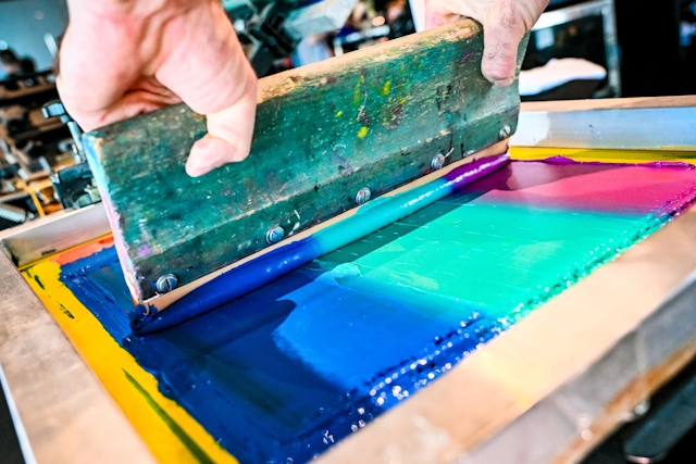 Closeup of the paint-like material used in a t-shirt printing press.