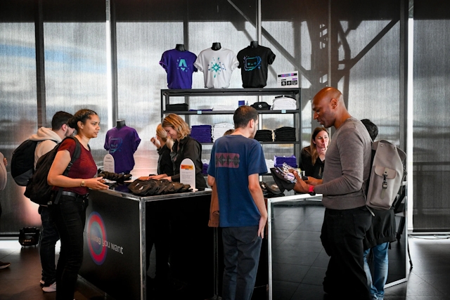 Guests at the swag bar retrieving their belted bags and t-shirts.