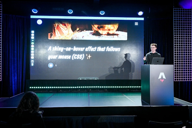 Ben Holmes on stage at the podium, sharing a demo for a shiny-on-hover effect that follows your mouse.