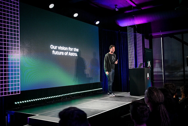 Fred K. Schott speaking on stage next to an Astro-branded podium. He is introducing the team vision for the future of Astro.