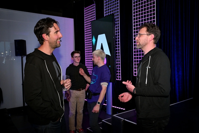 Fred K. Schott speaking to Matt Kane at side-stage after the presentation.